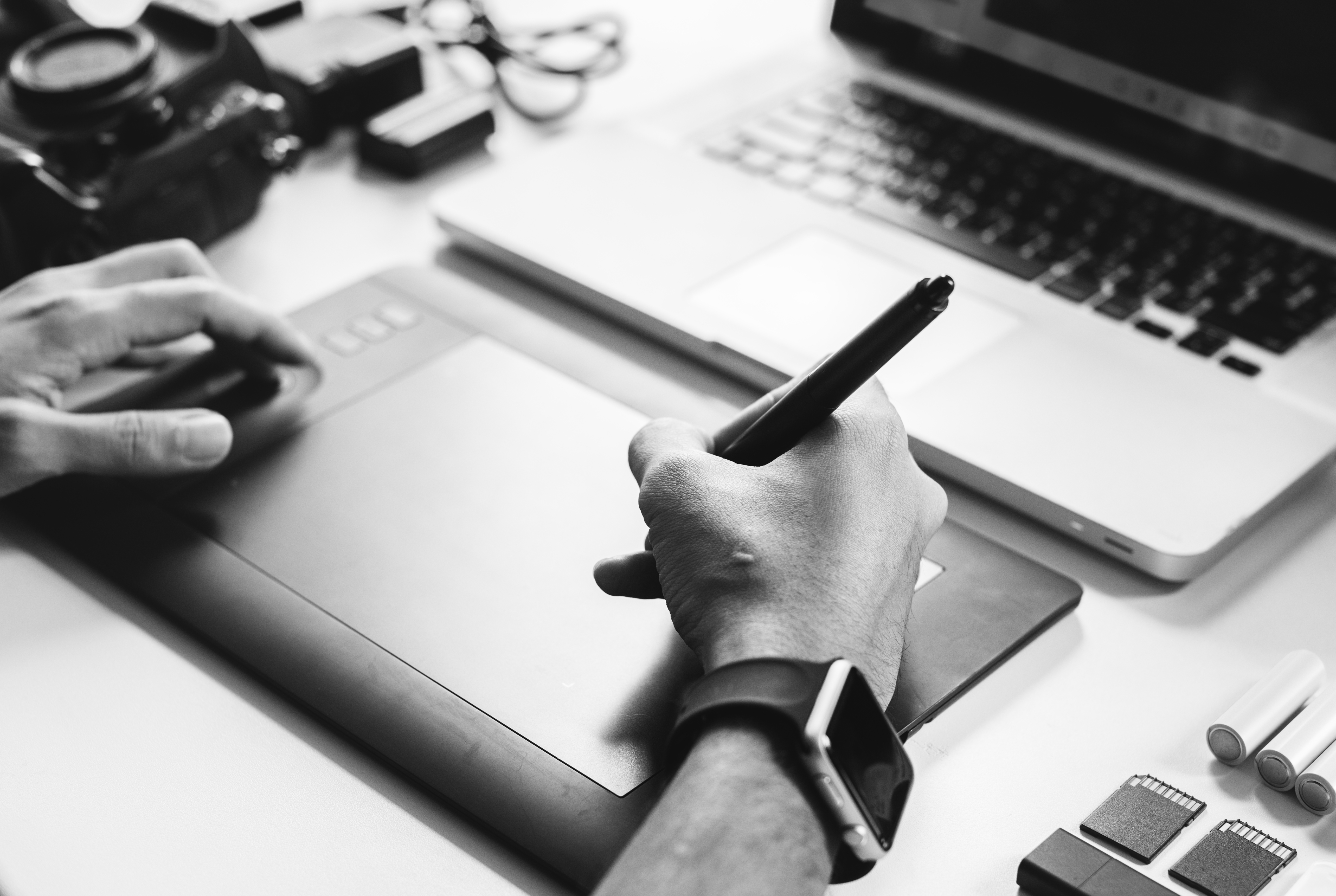 Design and sketching process for Woopak solutions Sketches and laptop showing the design process